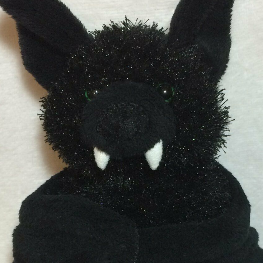 A black bat plushie